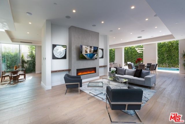 Dining room, Fireplace, Interior, Living room, Recessed Lighting, Wood Texture Flooring