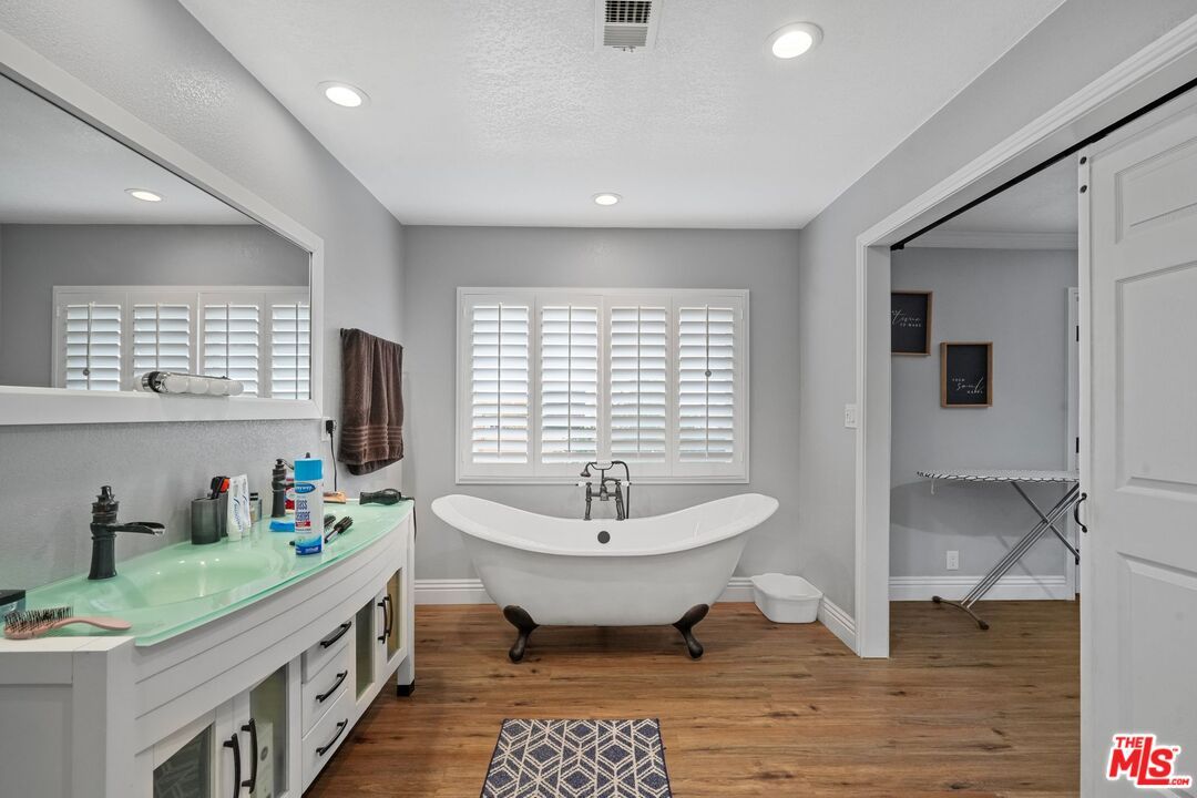 Bathroom, Dual Sink Vanities, Free Standing Baths, Interior, Recessed Lighting, Wood Texture Flooring