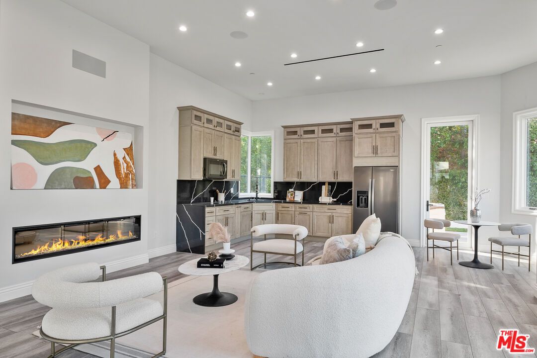 Fireplace, Interior, Kitchen, Living room, Recessed Lighting, Stainless Steel Appliances, Wood Texture Flooring