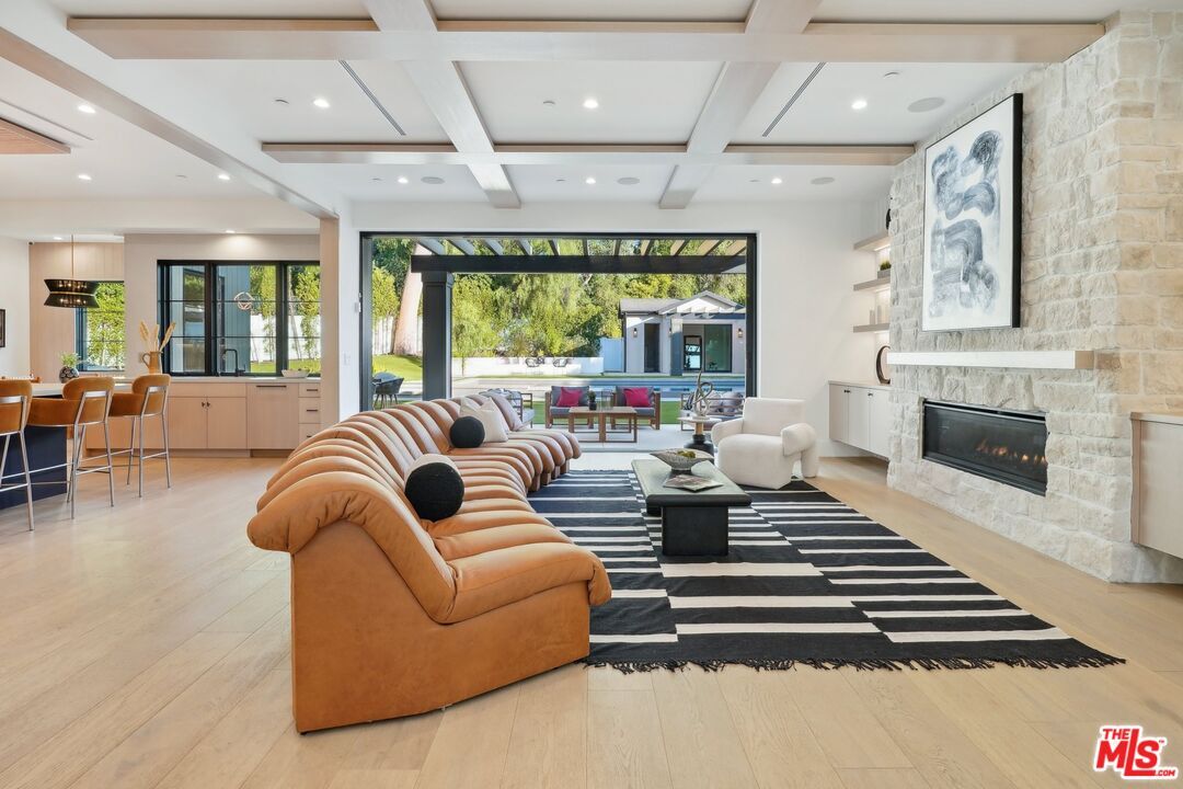 Fireplace, Interior, Living room, Pendant Lights, Recessed Lighting, Stone Walls, Wood Texture Flooring