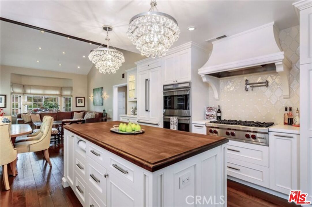 Chandelier, Dining room, Interior, Kitchen, Living room, Recessed Lighting, Stainless Steel Appliances, Wood Texture Flooring