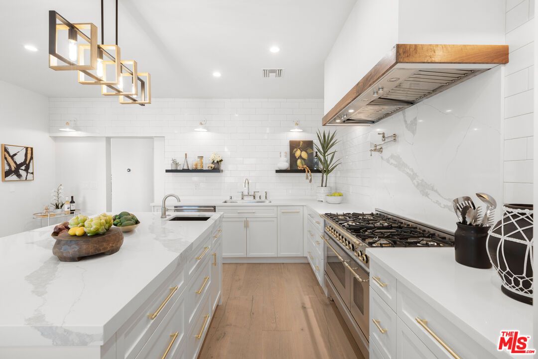 Interior, Kitchen, Marble Walls, Pendant Lights, Recessed Lighting, Stainless Steel Appliances, Wood Texture Flooring