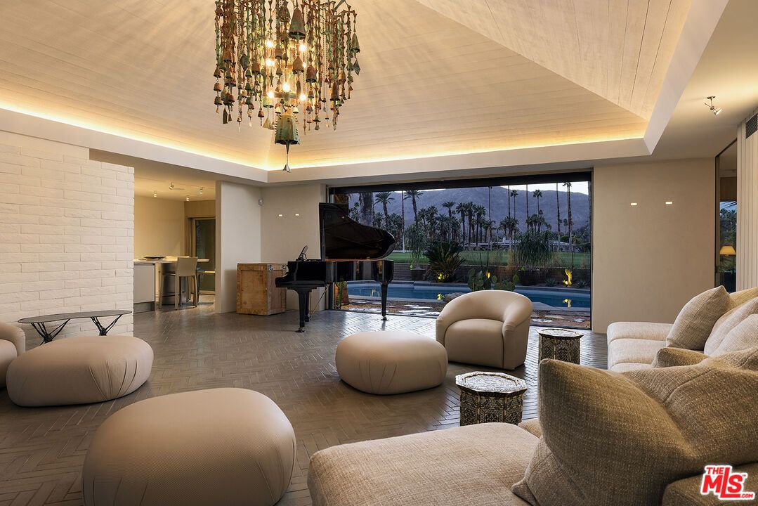 Chandelier, Interior, Living room, Pendant Lights, Piano, Recessed Lighting, Stone Walls