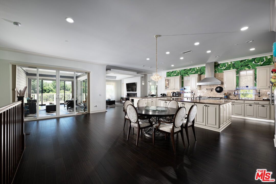 Chandelier, Dining room, Interior, Kitchen, Pendant Lights, Recessed Lighting, Stainless Steel Appliances, Wood Texture Flooring