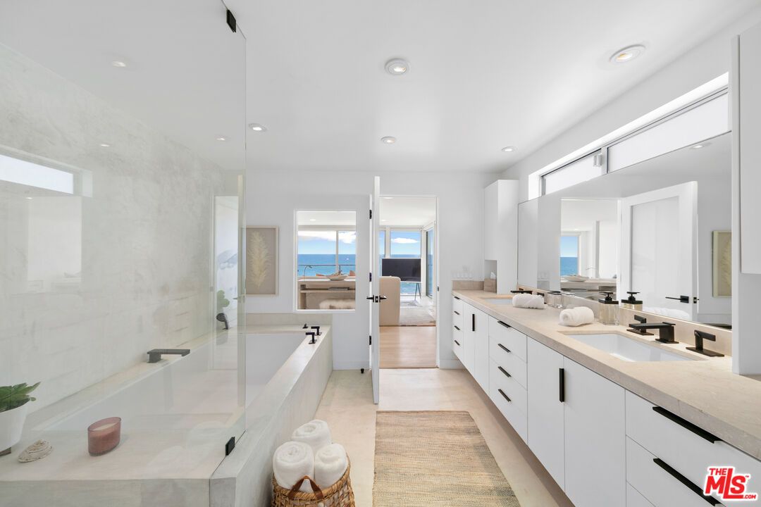Bathroom, Dual Sink Vanities, Glass Shower, Interior, Recessed Lighting, Water, Wood Texture Flooring