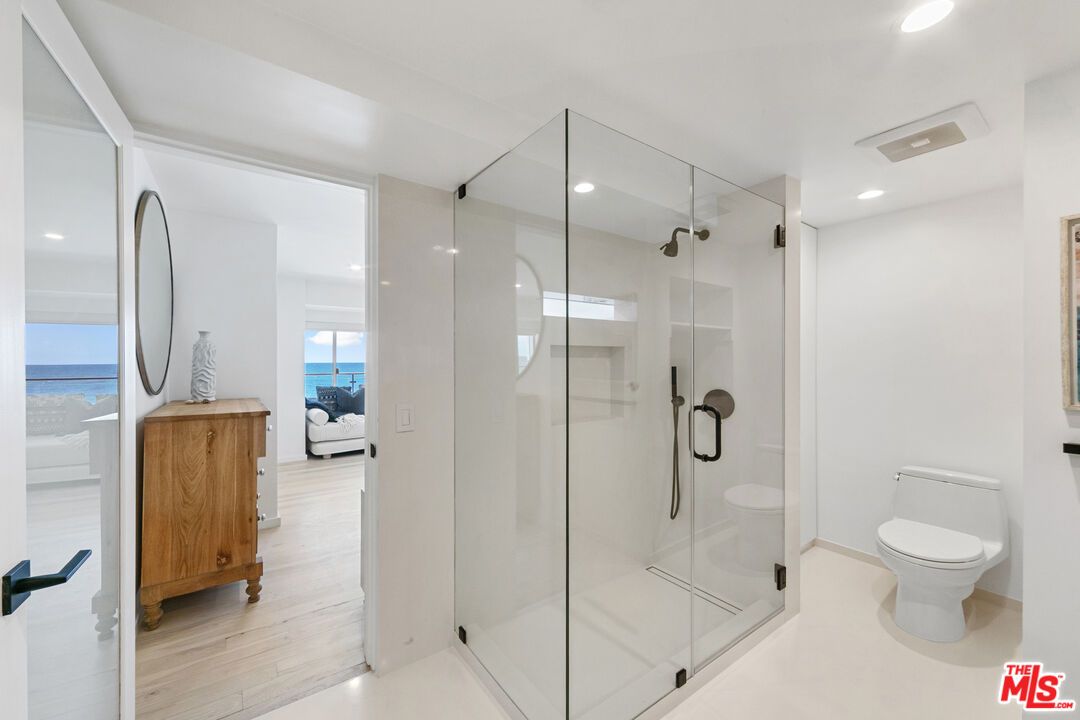 Bathroom, Glass Shower, Interior, Recessed Lighting, Water, Wood Texture Flooring
