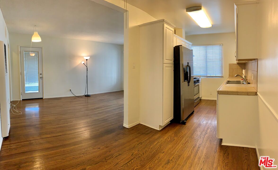 Interior, Kitchen, Pendant Lights, Tile Countertops, Wood Texture Flooring