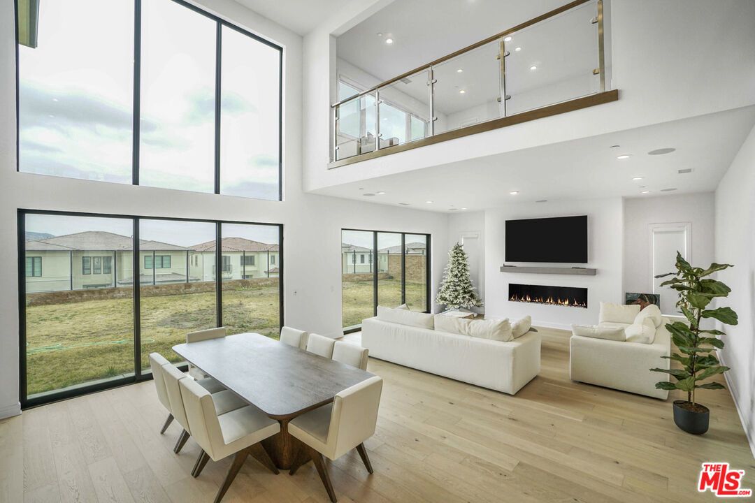 Dining room, Fireplace, Interior, Living room, Recessed Lighting, Wood Texture Flooring