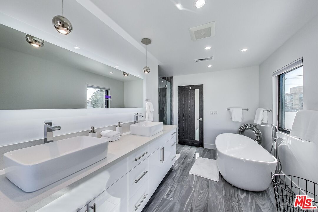 Bathroom, Dual Sink Vanities, Free Standing Baths, Interior, Pendant Lights, Recessed Lighting, Wood Texture Flooring