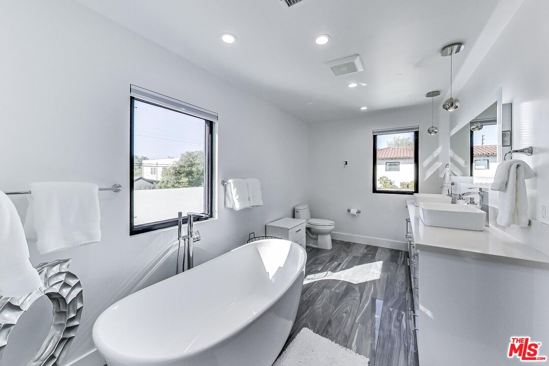 Bathroom, Dual Sink Vanities, Free Standing Baths, Interior, Pendant Lights, Recessed Lighting, Wood Texture Flooring