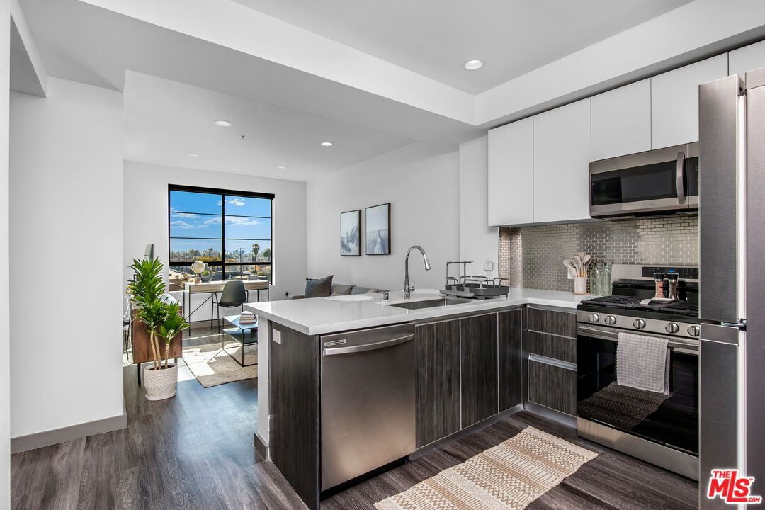 Dining room, Interior, Kitchen, Recessed Lighting, Stainless Steel Appliances, Wood Texture Flooring