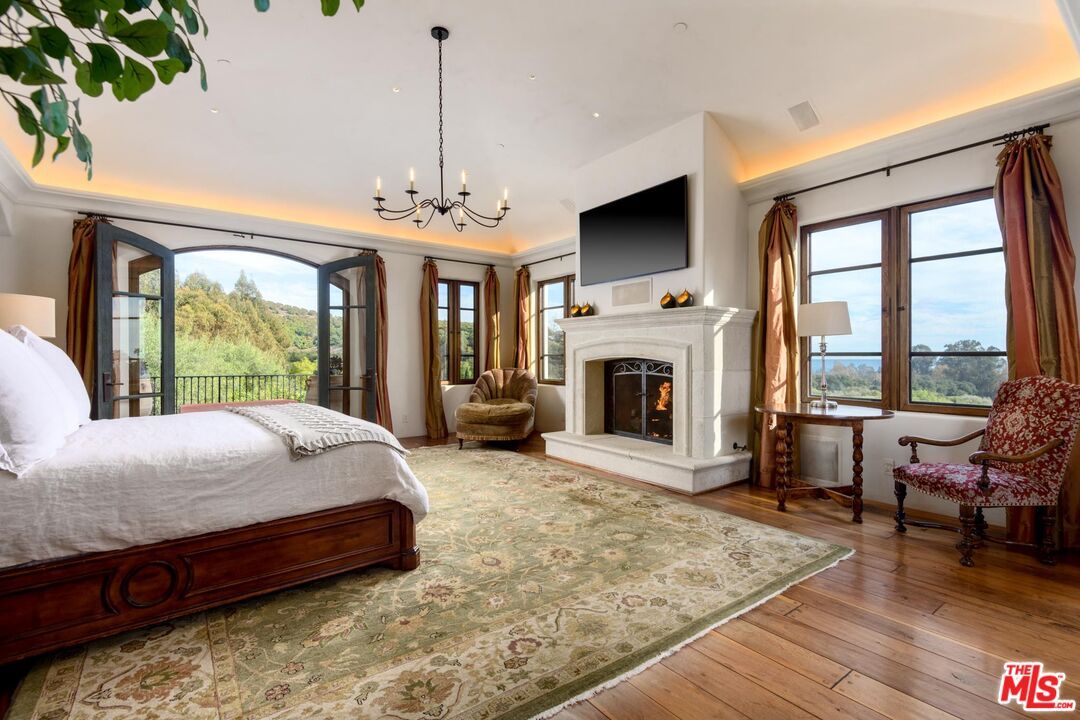 Bedroom, Chandelier, Fireplace, Interior, Recessed Lighting, Wood Texture Flooring