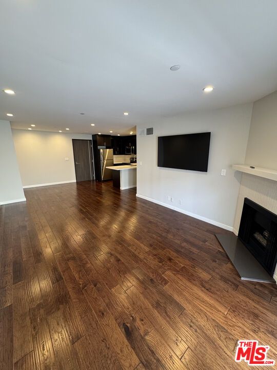Empty room, Fireplace, Interior, Kitchen, Recessed Lighting, Wood Texture Flooring