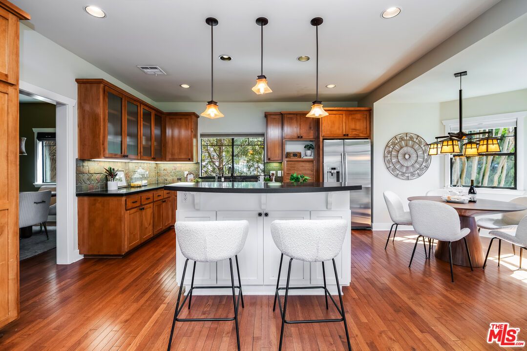 Dining room, Interior, Kitchen, Pendant Lights, Recessed Lighting, Stainless Steel Appliances, Wood Texture Flooring