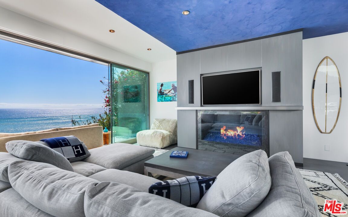 Fireplace, Interior, Living room, Recessed Lighting, Water, Wood Texture Flooring