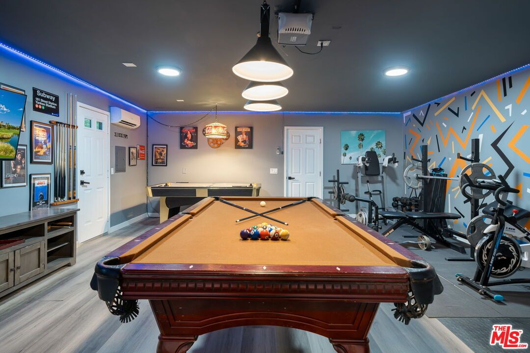 Billiard Table, Fitness Equipment, Game Room, Interior, Pendant Lights, Recessed Lighting, Wood Texture Flooring