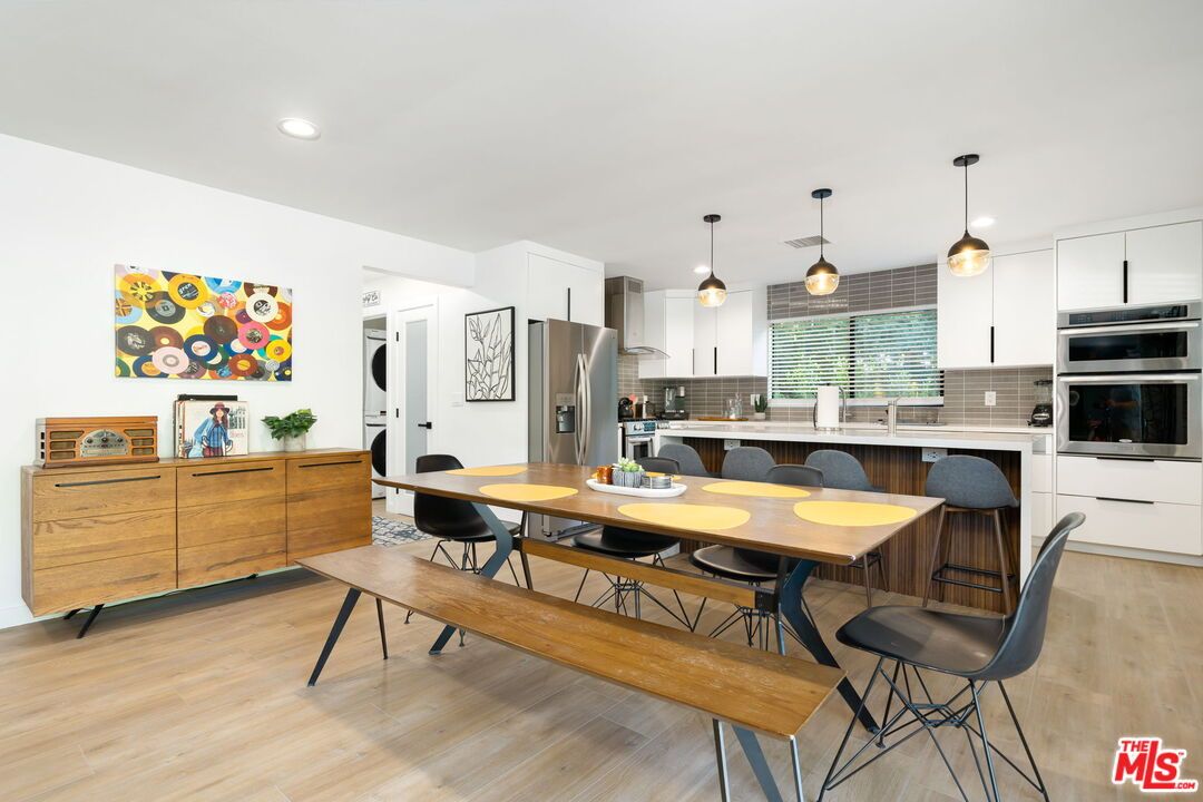 Dining room, Interior, Kitchen, Pendant Lights, Recessed Lighting, Stainless Steel Appliances, Wood Texture Flooring