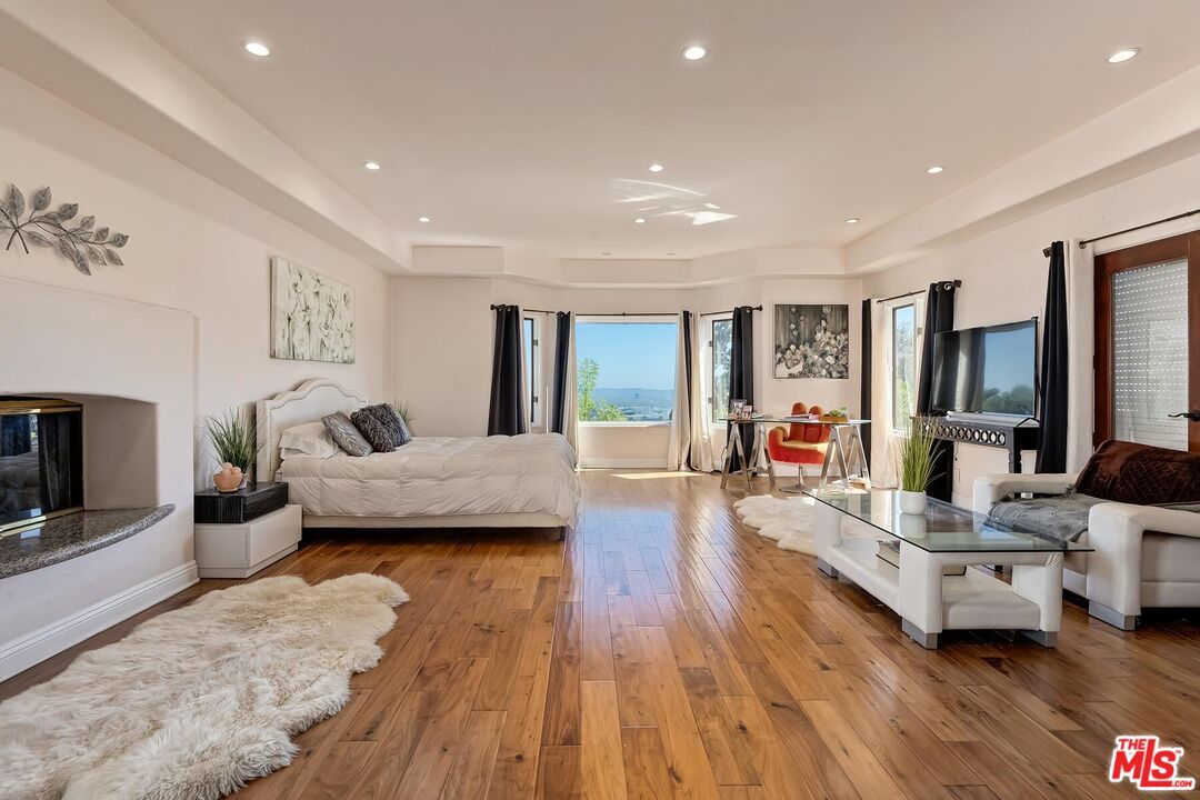 Bedroom, Fireplace, Interior, Recessed Lighting, Wood Texture Flooring