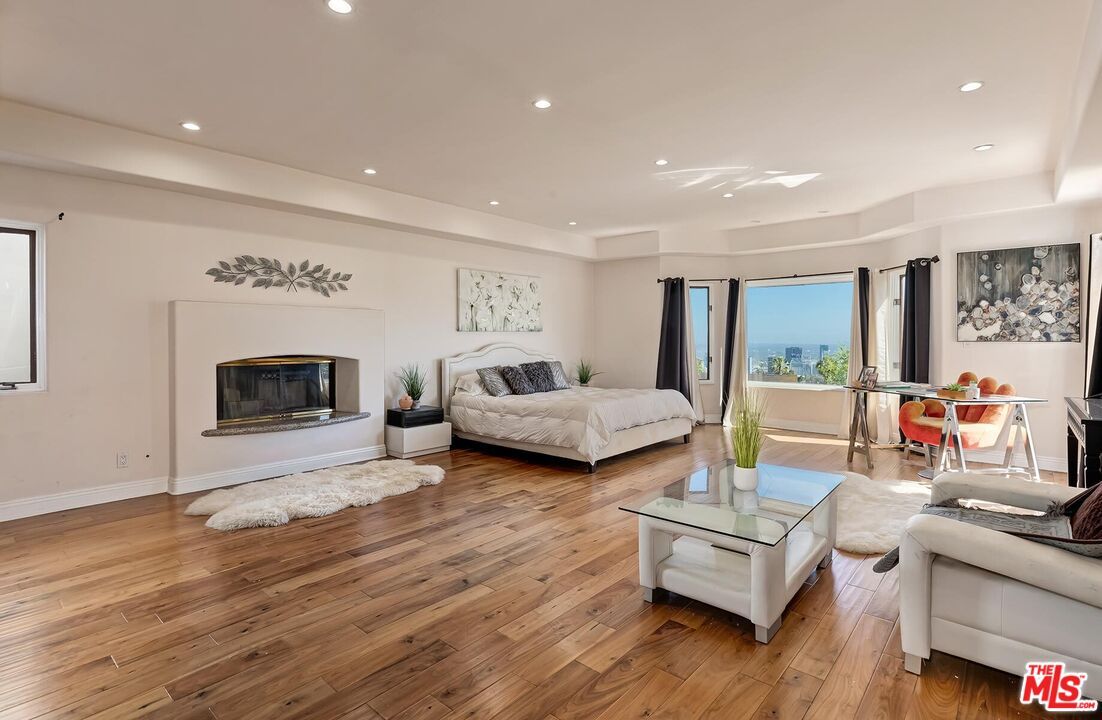 Bedroom, Fireplace, Interior, Living room, Recessed Lighting, Wood Texture Flooring