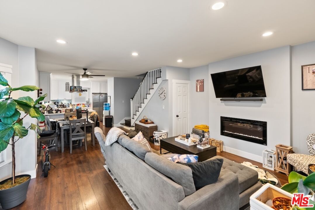 Dining room, Fireplace, Interior, Living room, Recessed Lighting, Wood Texture Flooring
