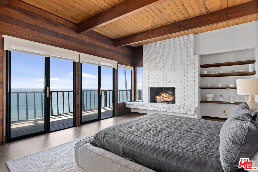Bedroom, Fireplace, Interior, Stone Walls, Water, Wooden Beams, Wooden Ceilings, Wood Texture Flooring