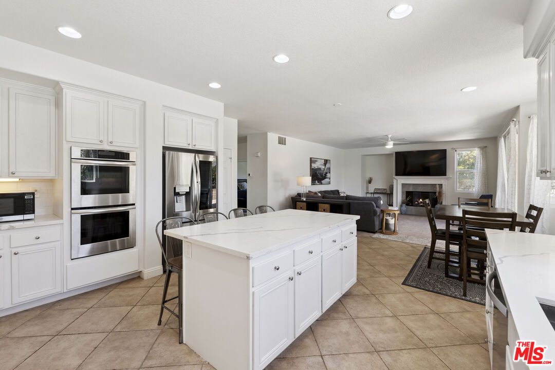 Dining room, Fireplace, Interior, Kitchen, Living room, Recessed Lighting, Stainless Steel Appliances