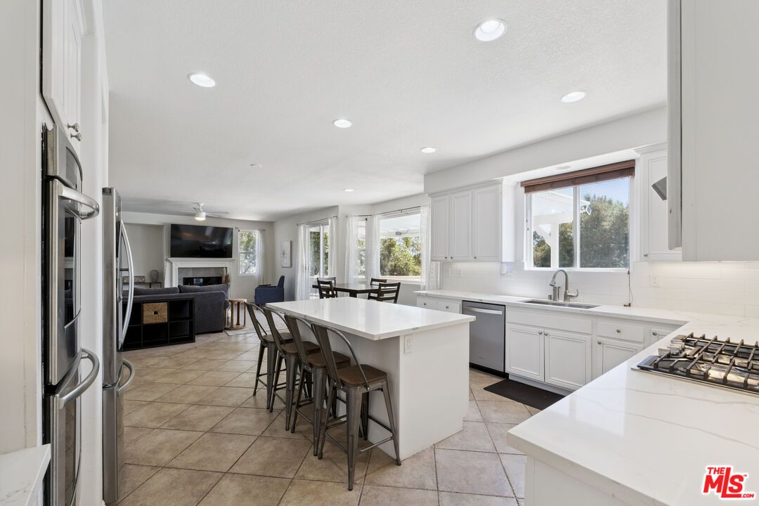 Dining room, Fireplace, Interior, Kitchen, Living room, Recessed Lighting, Stainless Steel Appliances