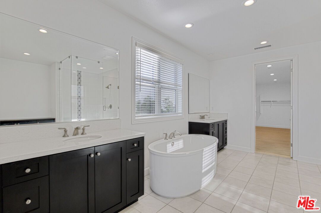 Bathroom, Dual Sink Vanities, Free Standing Baths, Glass Shower, Interior, Recessed Lighting, Wood Texture Flooring