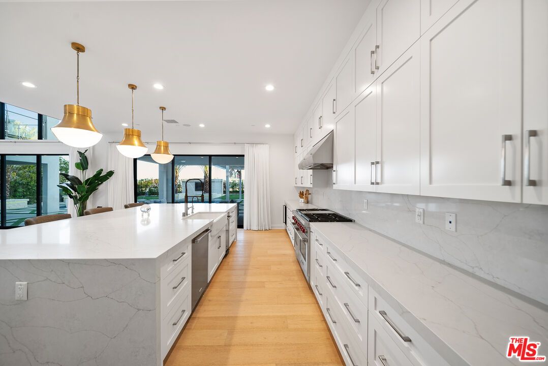 Interior, Kitchen, Marble Walls, Pendant Lights, Recessed Lighting, Stainless Steel Appliances, Wood Texture Flooring