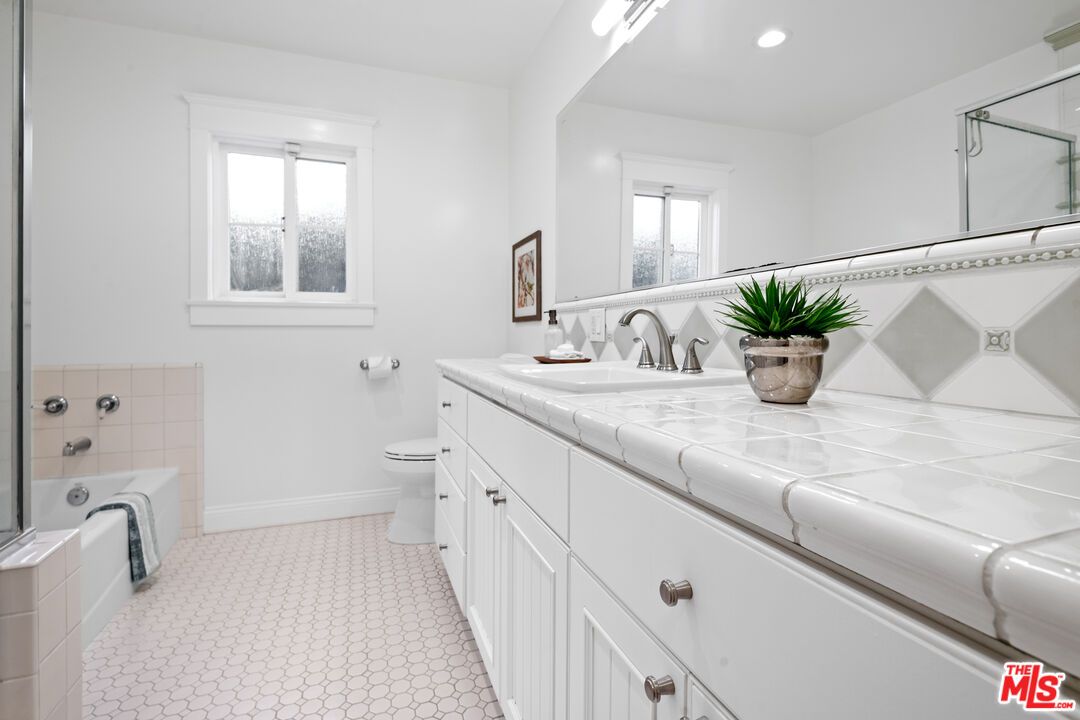 Bathroom, Dual Sink Vanities, Interior, Recessed Lighting, Tile Countertops