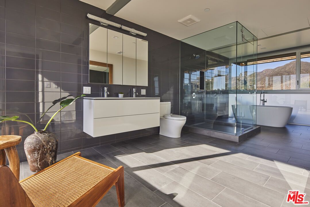 Bathroom, Free Standing Baths, Glass Shower, Interior, Recessed Lighting, Wood Texture Flooring