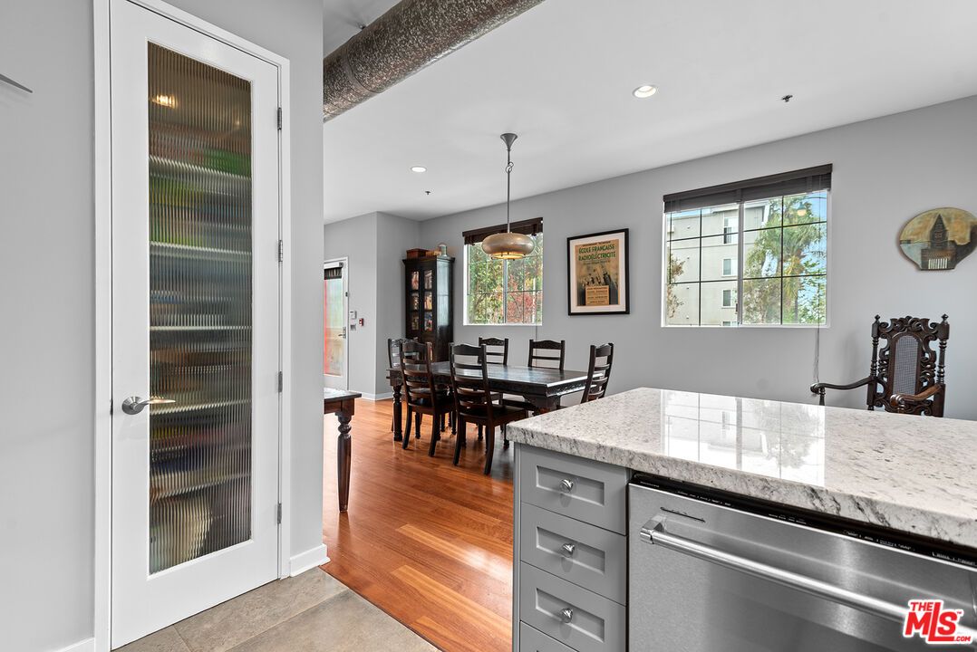Dining room, Interior, Kitchen, Pendant Lights, Recessed Lighting, Stainless Steel Appliances, Wood Texture Flooring