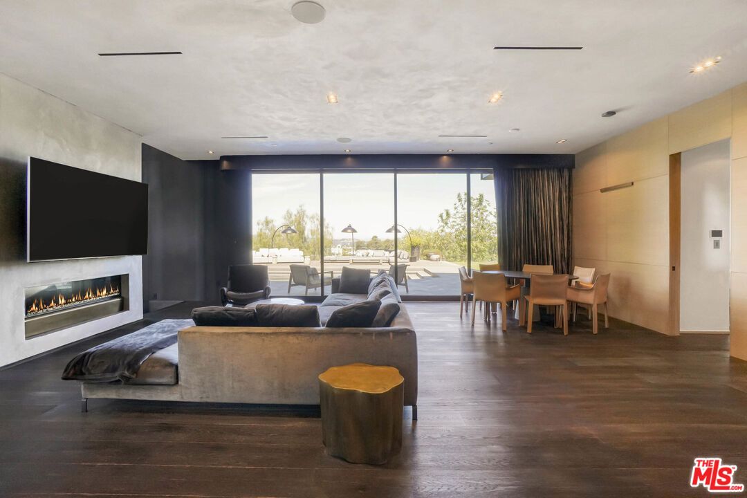 Dining room, Fireplace, Interior, Living room, Recessed Lighting, Wood Texture Flooring