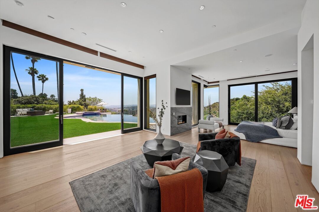Fireplace, Interior, Living room, Recessed Lighting, Water, Wood Texture Flooring