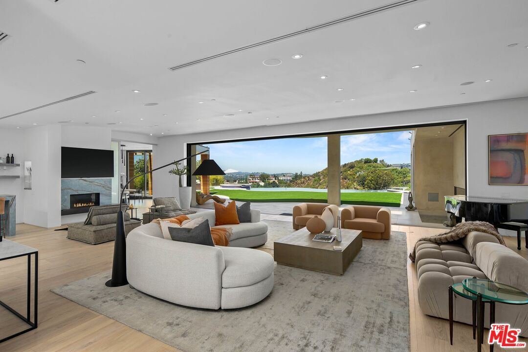 Fireplace, Interior, Living room, Piano, Recessed Lighting, Wood Texture Flooring