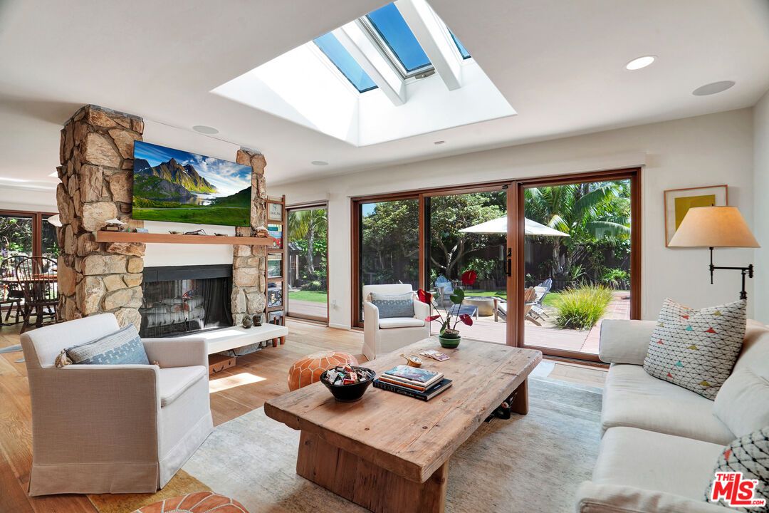 Fireplace, Glass Ceilings, Interior, Living room, Recessed Lighting, Stone Walls, Wood Texture Flooring