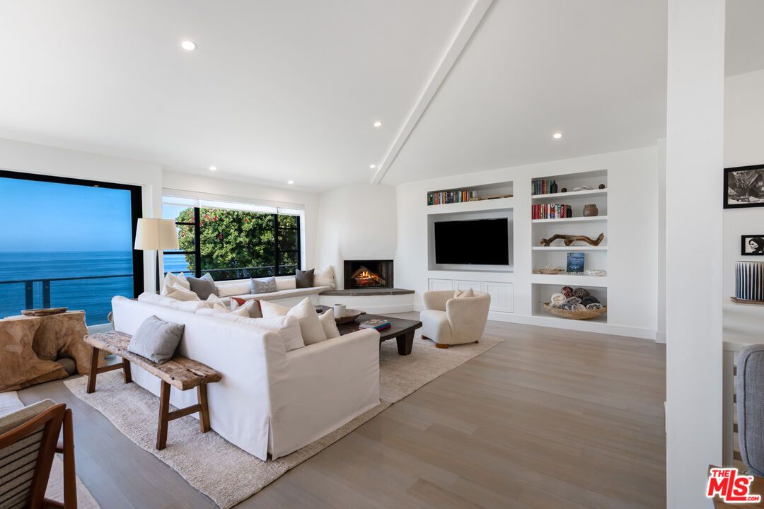 Fireplace, Interior, Living room, Recessed Lighting, Water, Wood Texture Flooring