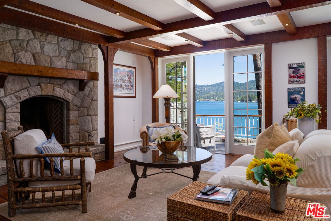 Fireplace, Interior, Living room, Recessed Lighting, Stone Walls, Water, Wooden Beams, Wood Texture Flooring