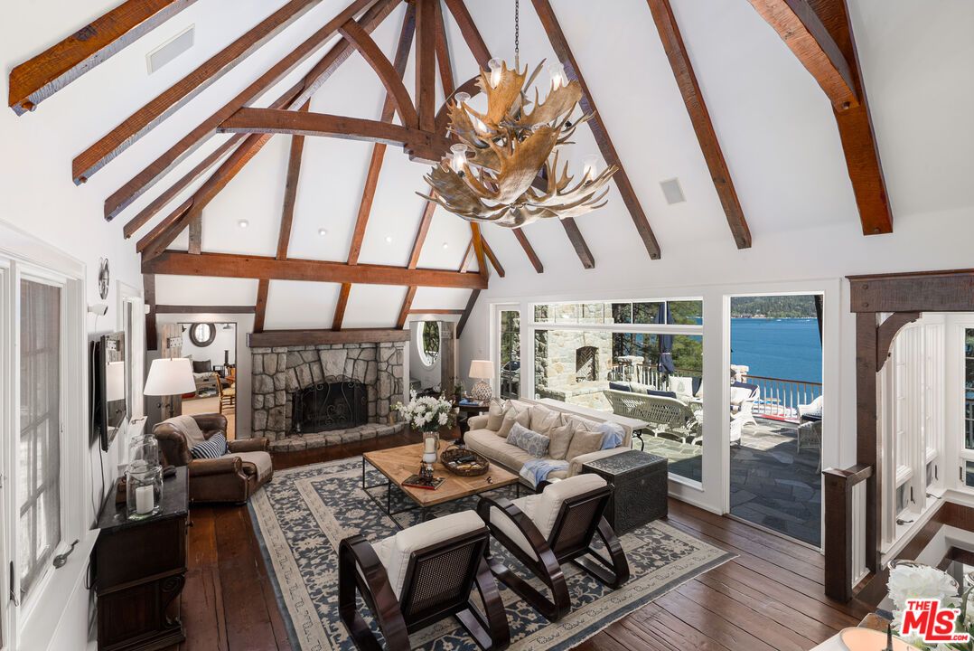 Chandelier, Fireplace, Interior, Living room, Recessed Lighting, Water, Wooden Beams, Wood Texture Flooring