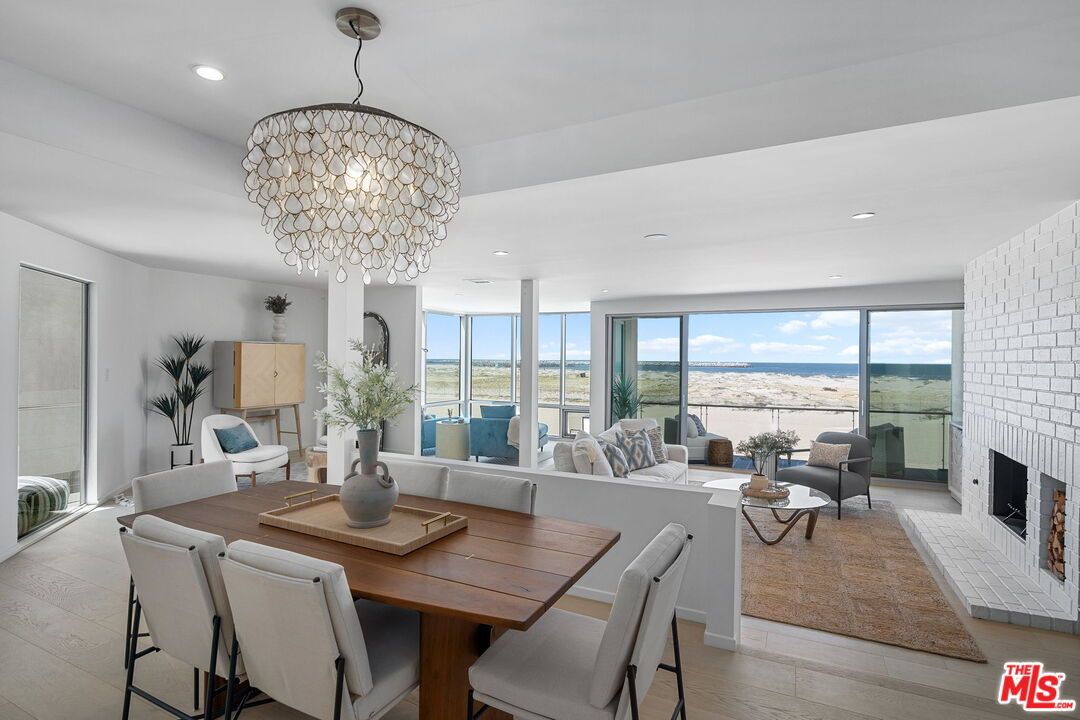 Chandelier, Dining room, Fireplace, Interior, Living room, Recessed Lighting, Water, Wood Texture Flooring