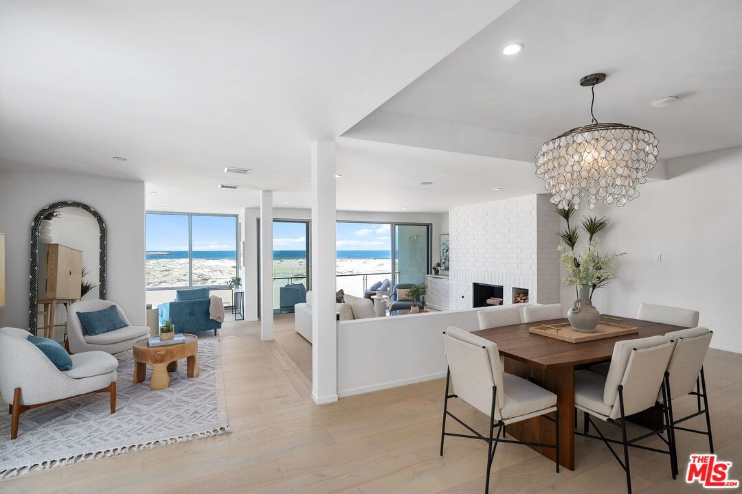 Chandelier, Dining room, Fireplace, Interior, Living room, Recessed Lighting, Water, Wood Texture Flooring