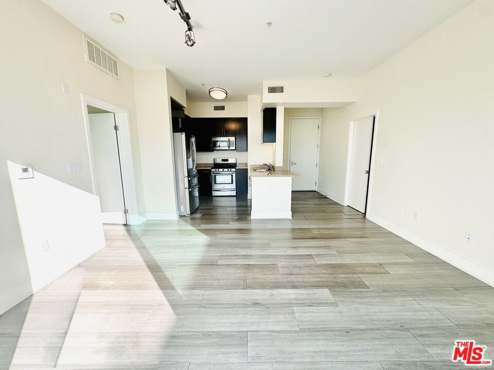 Empty room, Interior, Kitchen, Stainless Steel Appliances, Wood Texture Flooring