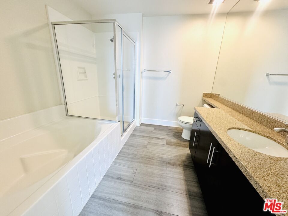 Bathroom, Dual Sink Vanities, Glass Shower, Interior, Wood Texture Flooring