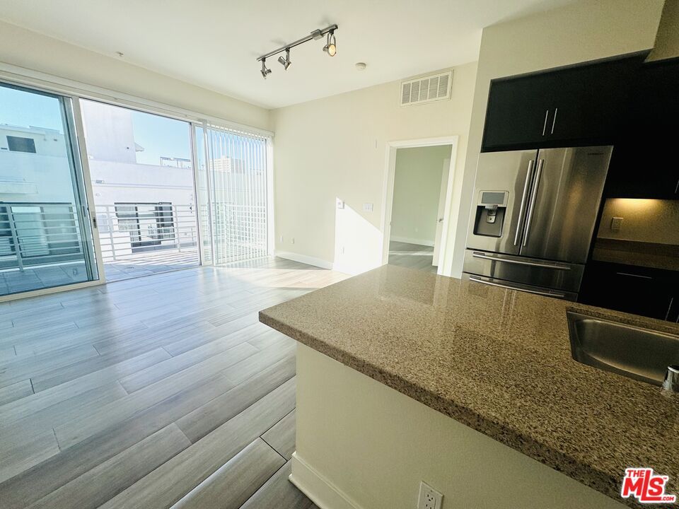 Empty room, Interior, Kitchen, Stainless Steel Appliances, Wood Texture Flooring