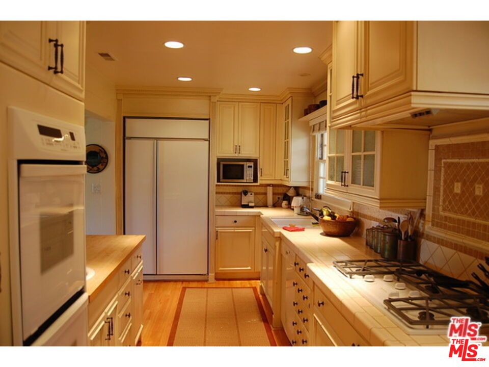 Interior, Kitchen, Recessed Lighting, Tile Countertops, Wood Texture Flooring