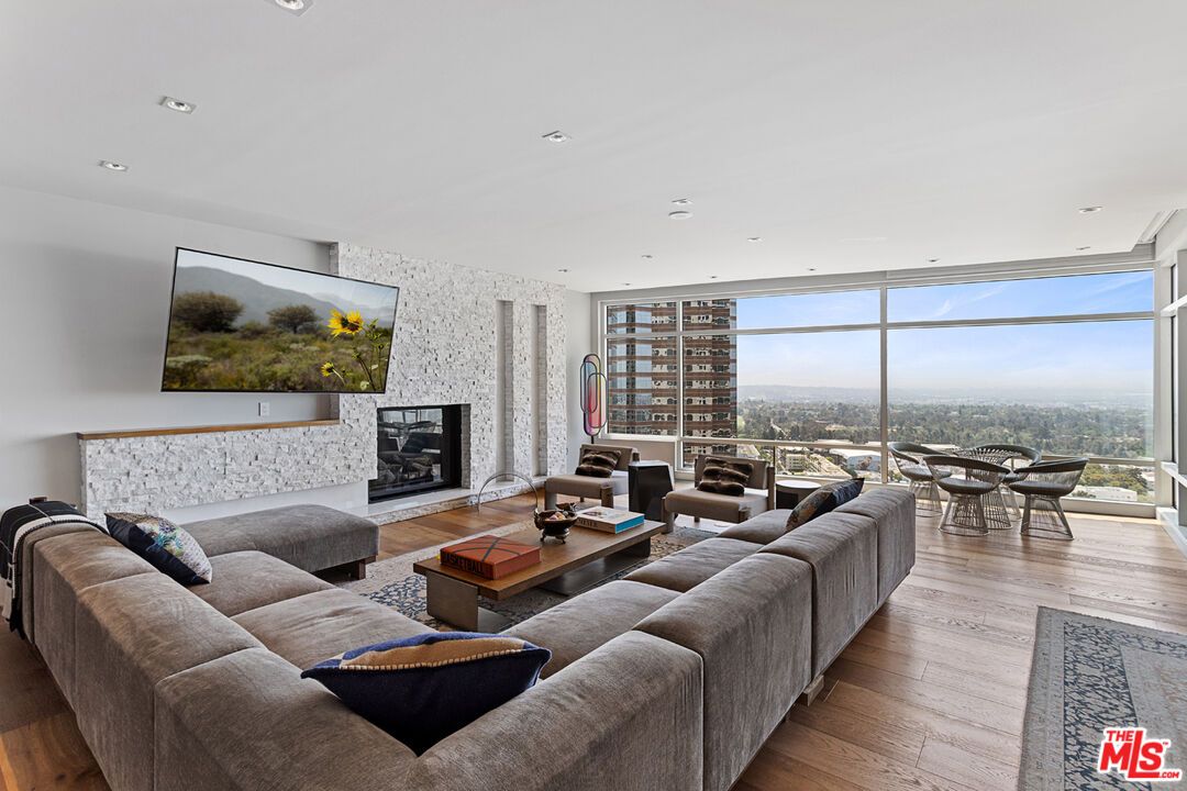 Fireplace, Interior, Living room, Recessed Lighting, Stone Walls, Wood Texture Flooring