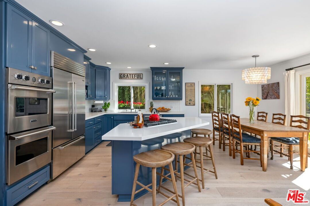 Chandelier, Dining room, Interior, Kitchen, Recessed Lighting, Stainless Steel Appliances, Wood Texture Flooring