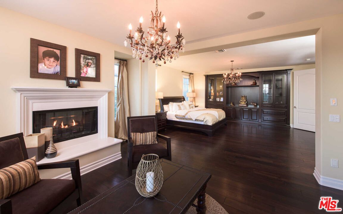 Bedroom, Chandelier, Fireplace, Interior, Recessed Lighting, Wood Texture Flooring