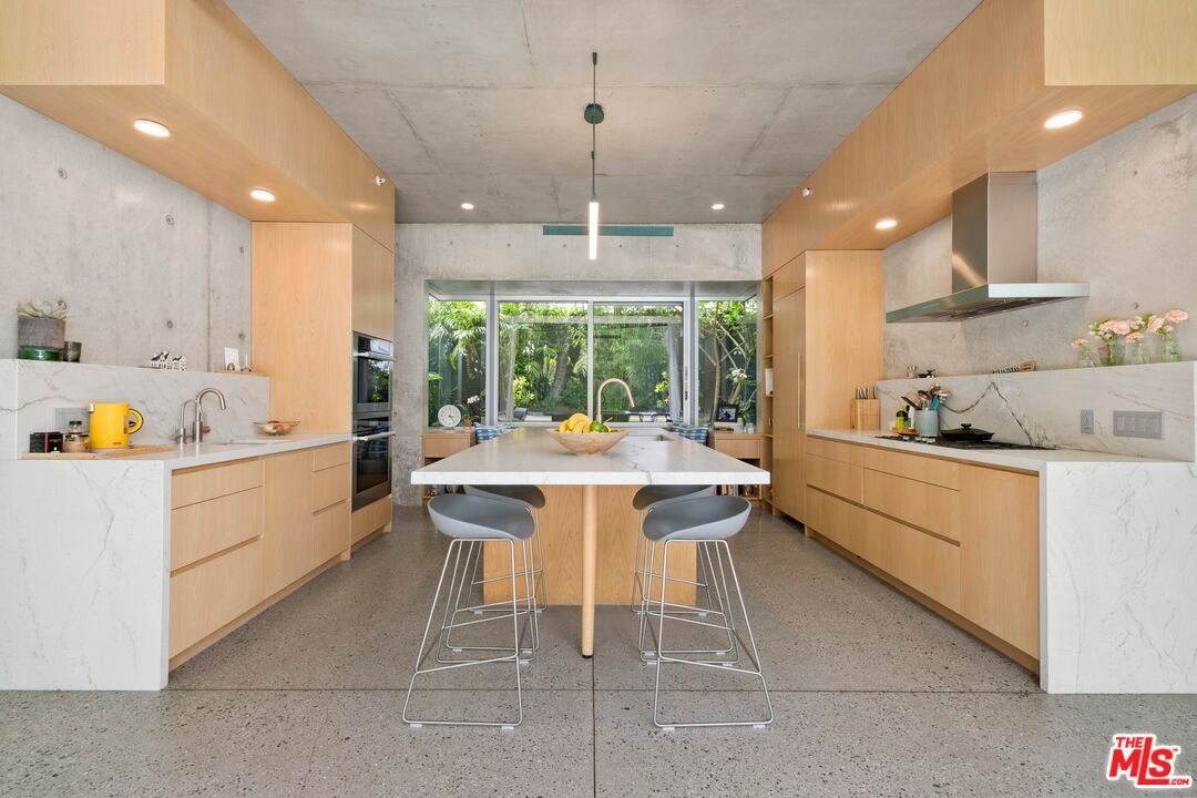 Interior, Kitchen, Marble Walls, Pendant Lights, Recessed Lighting, Stainless Steel Appliances
