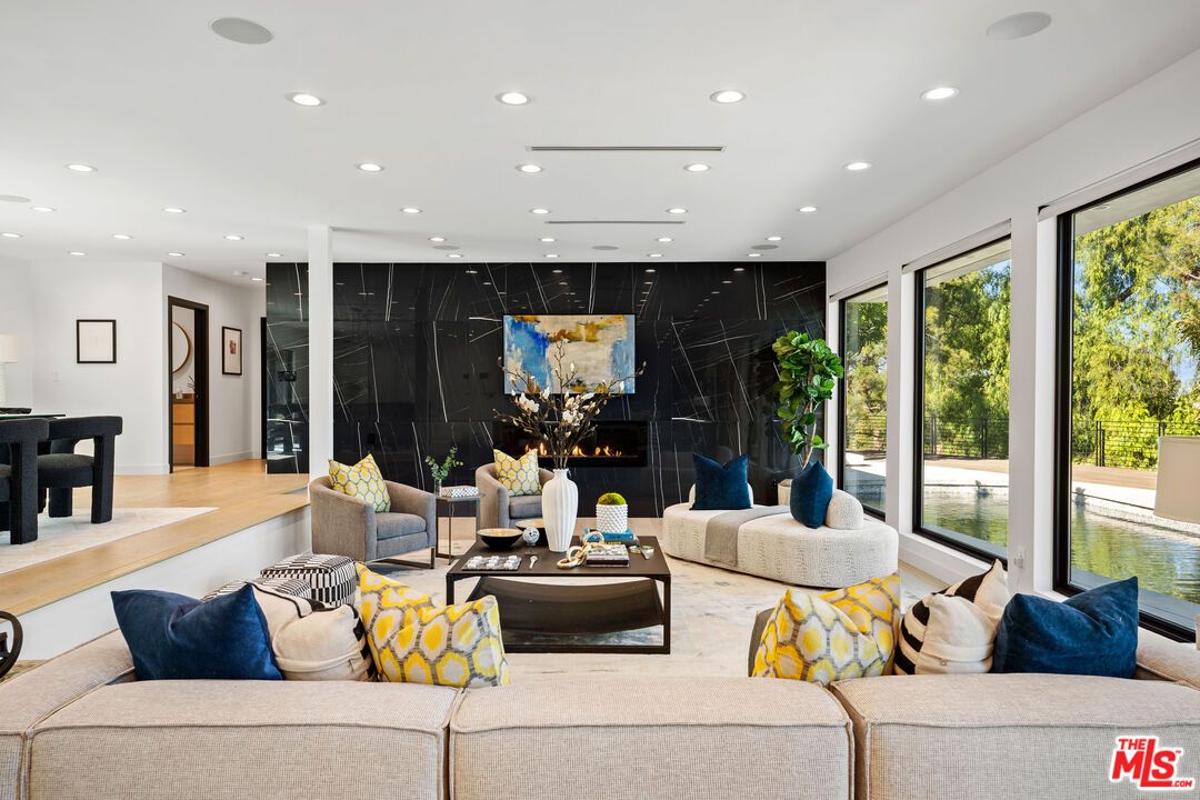 Fireplace, Interior, Living room, Marble Walls, Recessed Lighting, Wood Texture Flooring